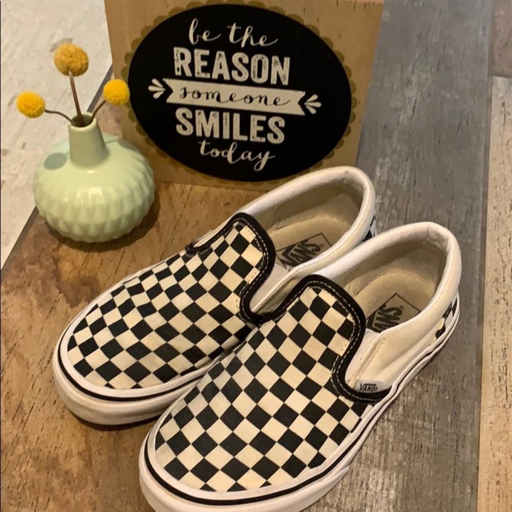 Kids slip on black and white checkered Vans 3